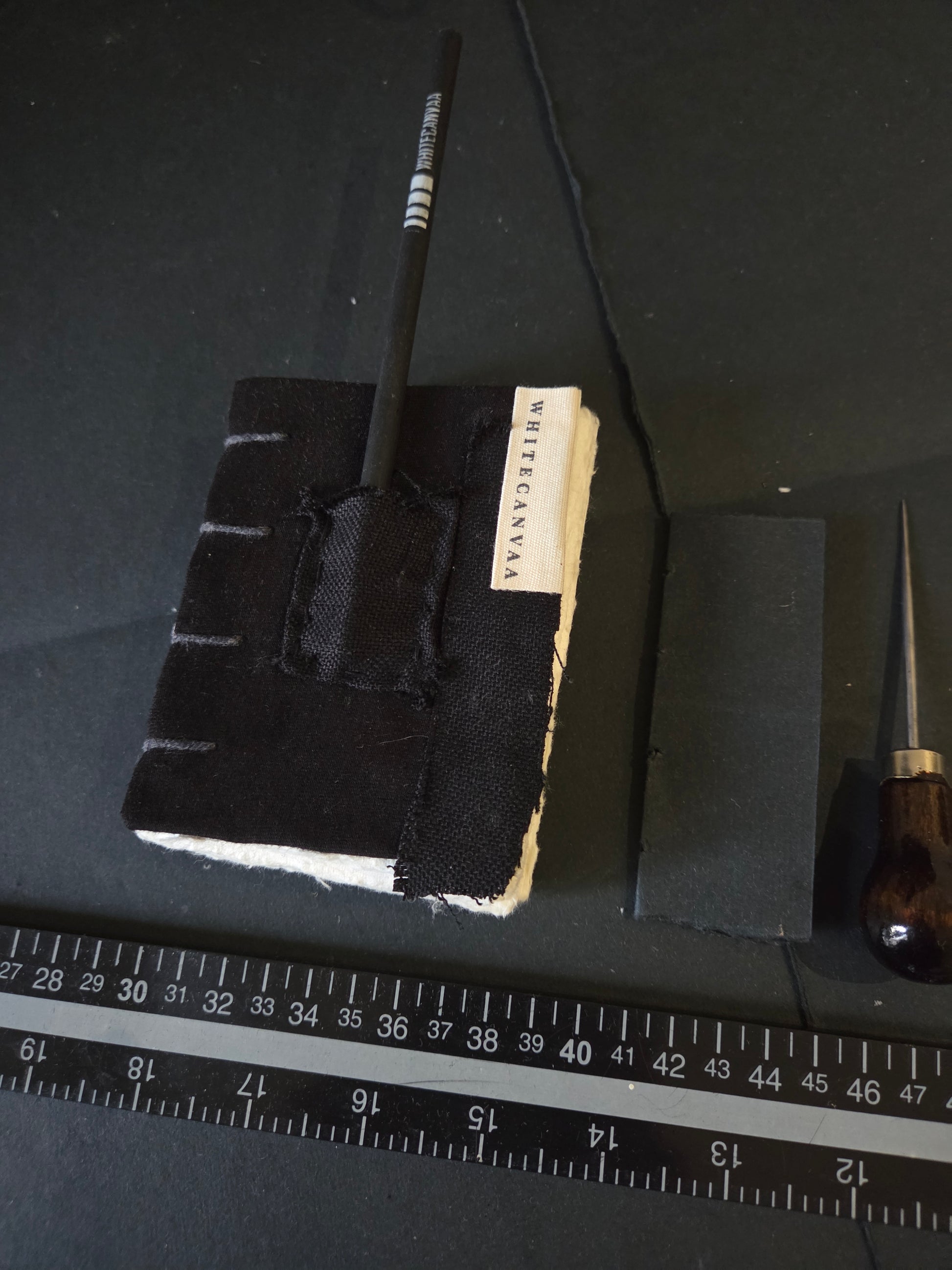 This pocket Journal  has a small pouch for keeping a small pencil, hand bound in copticstitch