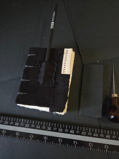 This pocket Journal  has a small pouch for keeping a small pencil, hand bound in copticstitch