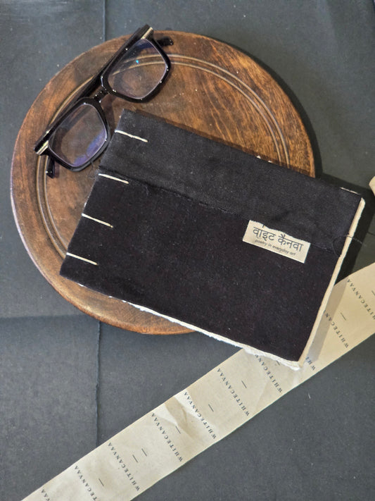This journal is made with joining two waste fabrics and stitched with cotton thread